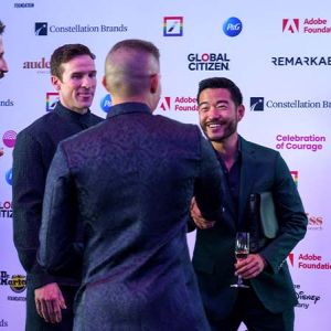 Actor Justin Chien greeting guests and activists at the Outright International Celebration of Courage gala