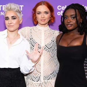Cast members of Star Trek: Discovery posing for a photo on the blue carpet at the Outright International Celebration of Courage event.