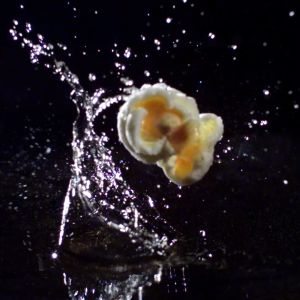 Detailed texture of expanding popcorn captured via high-intensity lighting and high-speed sensor.