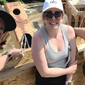 Director of Photography John Carboni with producers Samantha and Toni posing for a selfie while filming from a 30-foot platform for This Old House.