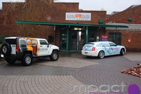 Guinness vehicles lined up at King Plow Arts Center during sampling event