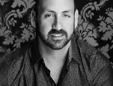 john-carboni-founder-impact-studios-headshot.webp