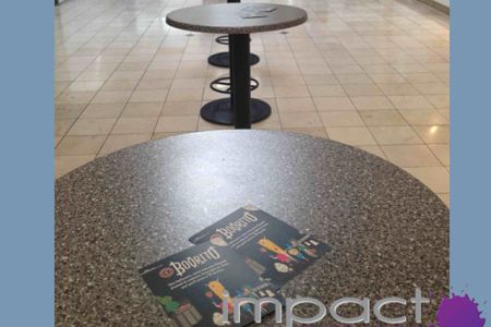 Placing restaurant coupons and pamphlets at truck stop for restaurant opening