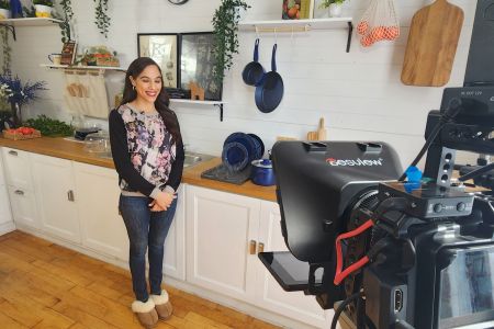 Professional Actress Utilizing Teleprompter Services For Corporate Studio Production At Impact Studios