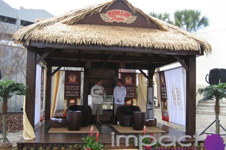 Sampling Hawaiian Tropic from a beach hut